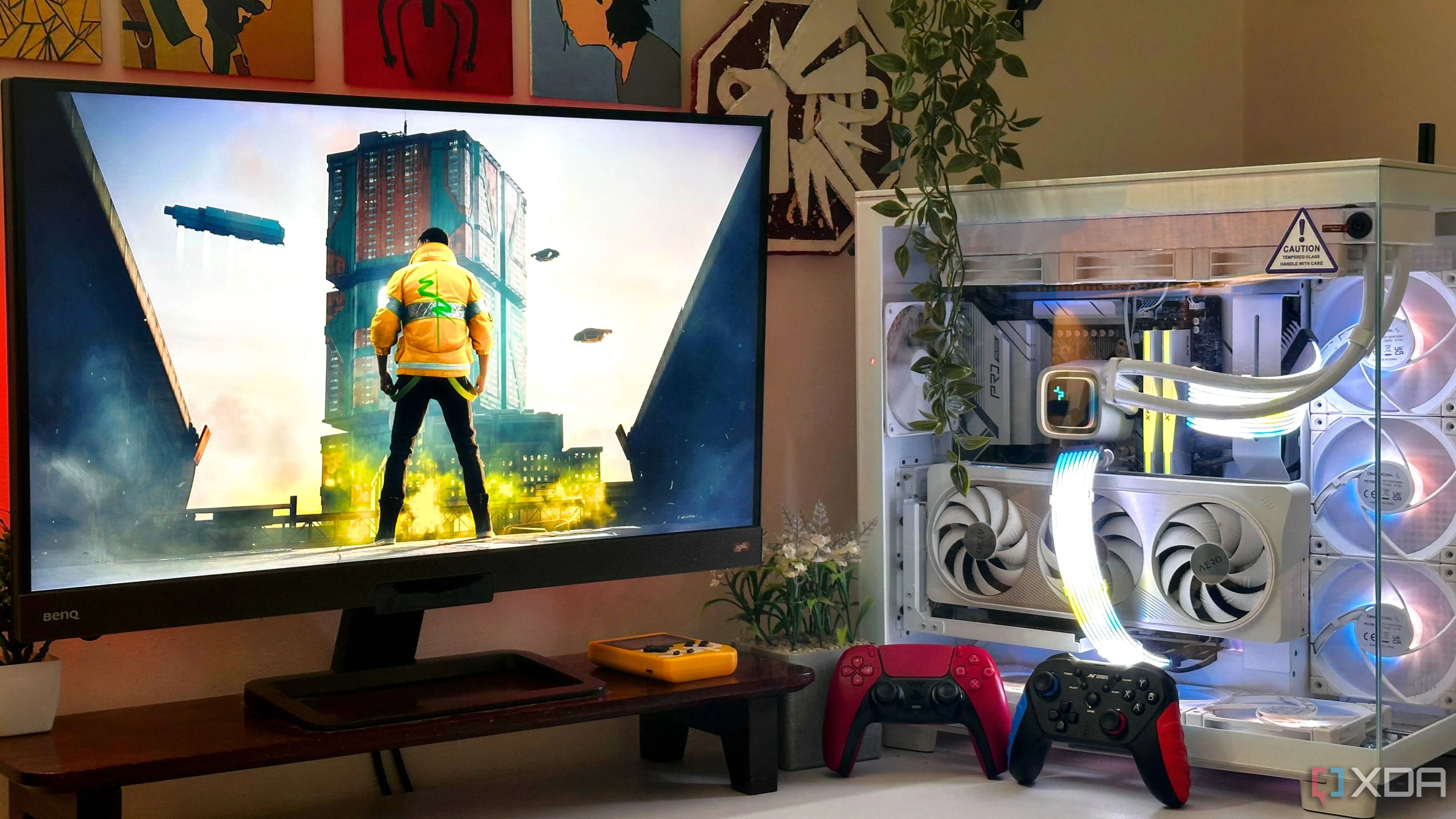 Cấu hình PC hiện đại với màn hình hiển thị game Cyberpunk 2077 và tay cầm chơi game