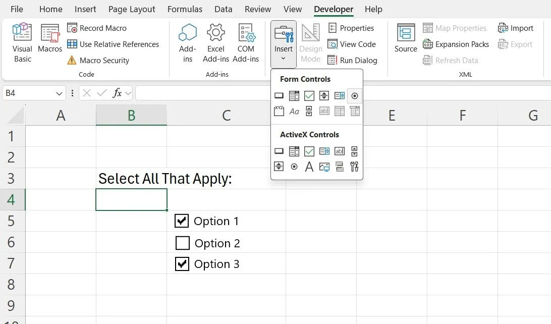 Tab Developer trong Excel hiển thị các tùy chọn kiểm soát biểu mẫu như hộp kiểm (checkbox) và nút lệnh